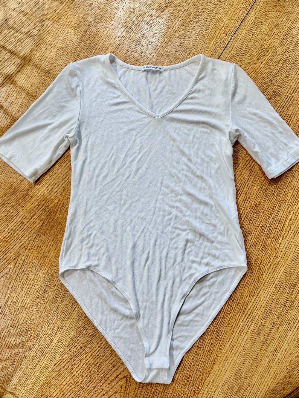 Long Sleeve White V-Neck Bodysuit by MANGOPOP